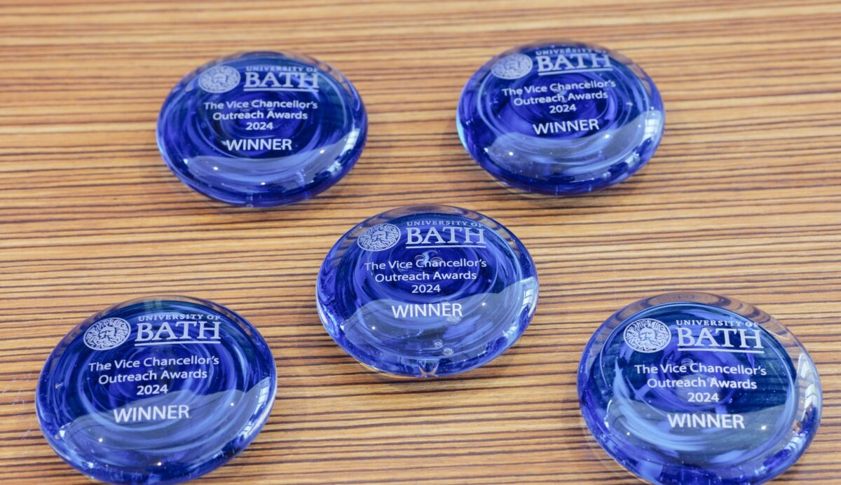 A group of 5 blue awards
