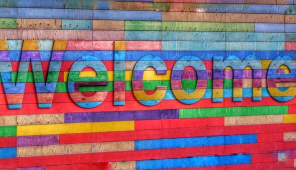 Colourful sign which says Welcome