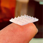 A small white patch balanced on a fingertip.
