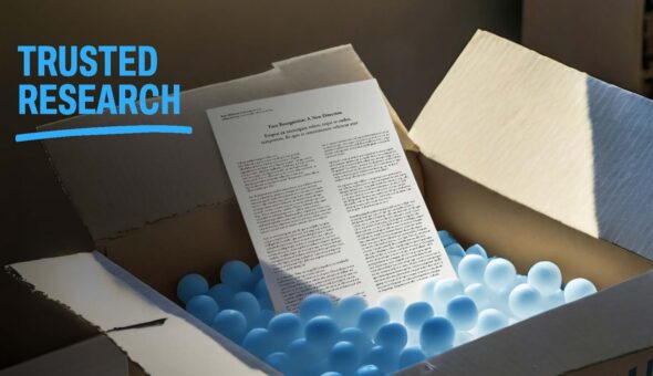 A scientific paper sitting in an open cardboard box full of packing cubes with a title saying trusted research
