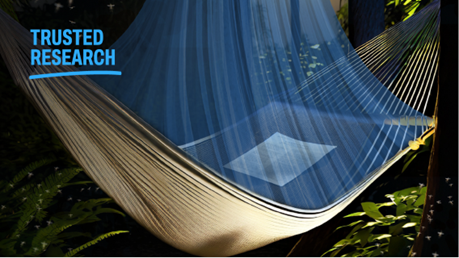 An academic manuscript is held in a hammock in the woods, a title of trusted research is highlighted in the corner